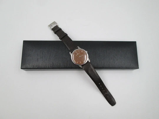 Universal Geneve rare dress watch. Ultra thin steel case and wooden dial. Manual wind