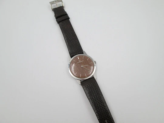 Universal Geneve rare dress watch. Ultra thin steel case and wooden dial. Manual wind