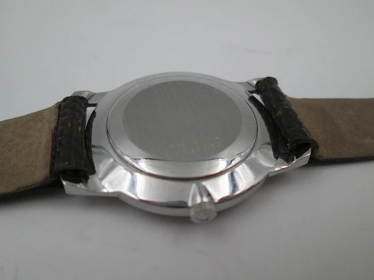 Universal Geneve rare dress watch. Ultra thin steel case and wooden dial. Manual wind