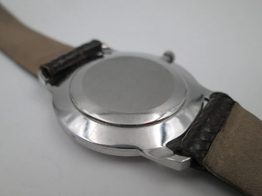 Universal Geneve rare dress watch. Ultra thin steel case and wooden dial. Manual wind