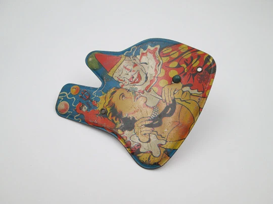 US Metal toy rattle. Lithographed tinplate and wood handle. Clown scene. 1940's. USA