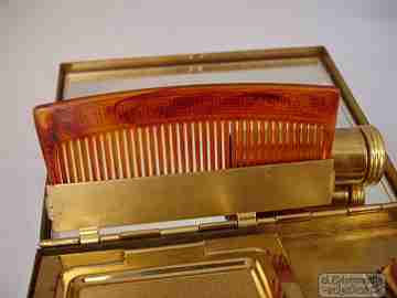 Vanity case. Rope chain. Golden metal. USA. 1930s. Lipstick. Mirror