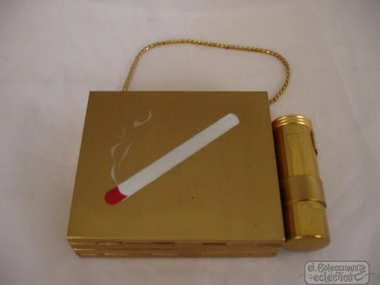 Vanity case. USA. Golden metal and enamel. 1940s. Lipstick. Mirror