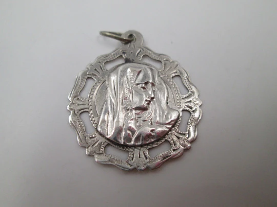 Virgin Mary sterling silver medal. Openwork design. Geometric motifs. Ring & hole. 1940's