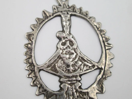 Virgin of the Head silver openwork medal. Crescent ornament and triangular edge