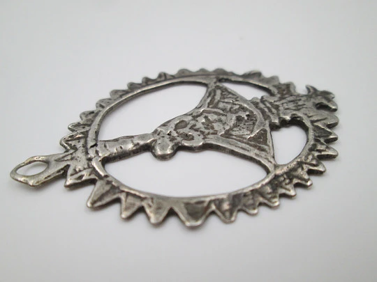 Virgin of the Head silver openwork medal. Crescent ornament and triangular edge