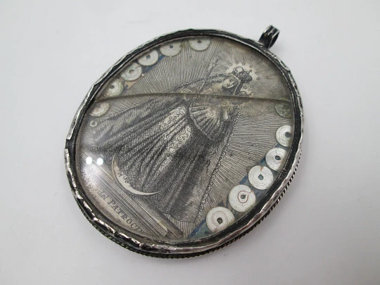 Virgin of the Patrocinio (Sevilla) oval reliquary. Sterling silver. 1870's. Spain