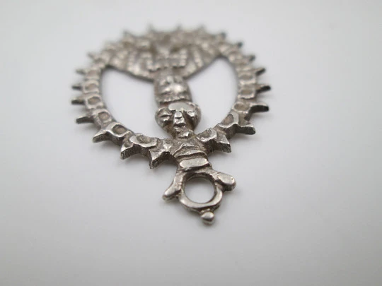 Virgin of the Tabernacle silver openwork medal. Sphere decorations and triangular edge. 1900's
