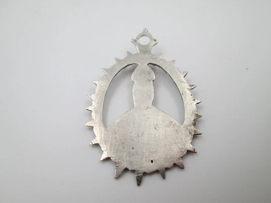 Virgin of the Tabernacle silver openwork medal. Sphere decorations and triangular edge. 1900's