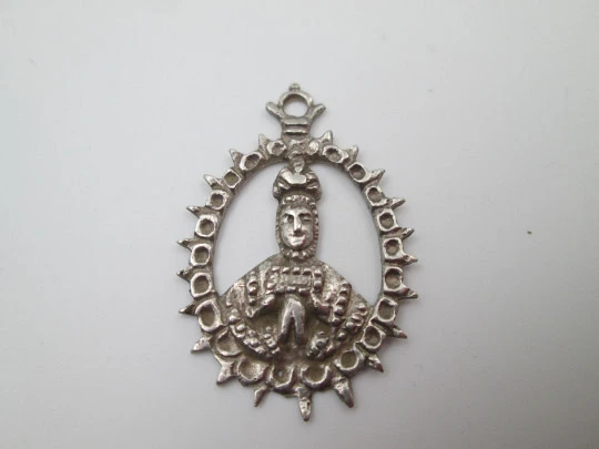 Virgin of the Tabernacle silver openwork medal. Sphere decorations and triangular edge. 1900's