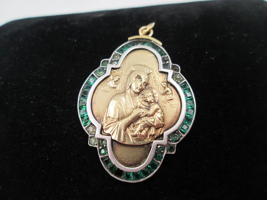 Virgin with Child art deco lobed medal. Yellow gold and sterling silver. Green gems. 1940's