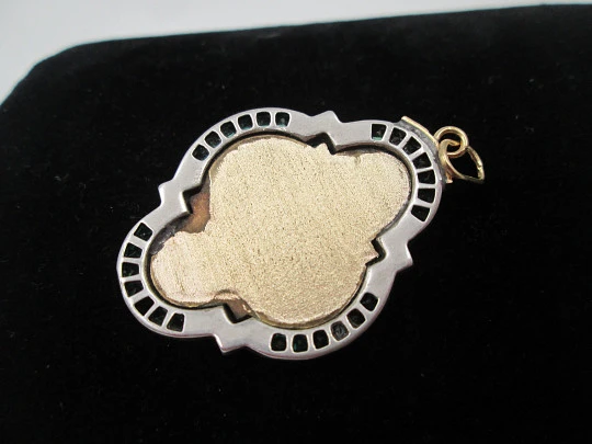 Virgin with Child art deco lobed medal. Yellow gold and sterling silver. Green gems. 1940's