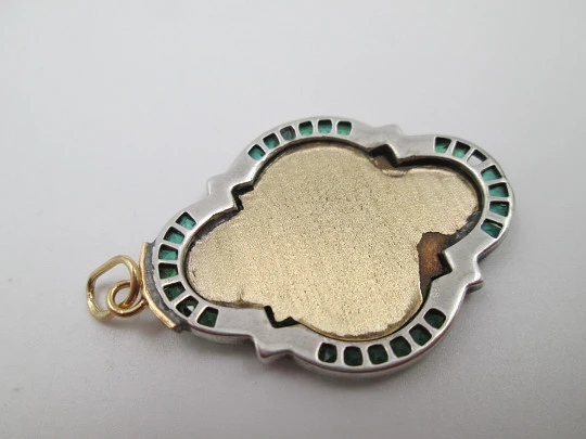 Virgin with Child art deco lobed medal. Yellow gold and sterling silver. Green gems. 1940's