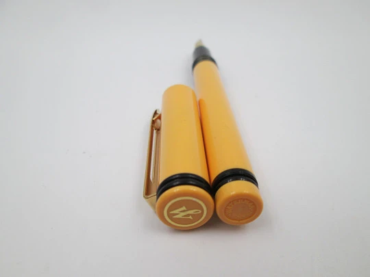 Waterman Forum. Bitone orange & black plastic. Golden plated details. France. 1980's