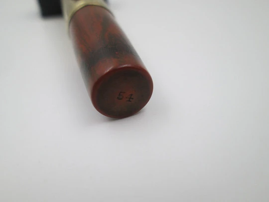 Waterman's Ideal 54. Veined red hard rubber and 18 karat yellow gold. 1920's. United States