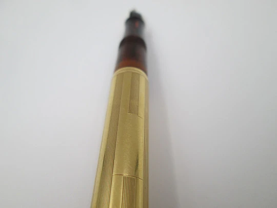 Waterman's Ideal 54. Veined red hard rubber and 18 karat yellow gold. 1920's. United States
