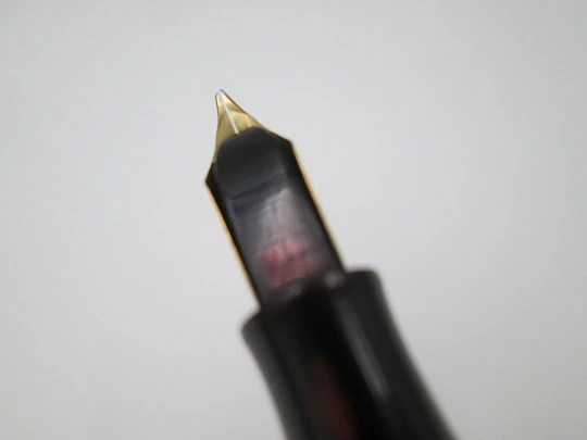 Waterman's Ideal 54. Veined red hard rubber and 18 karat yellow gold. 1920's. United States