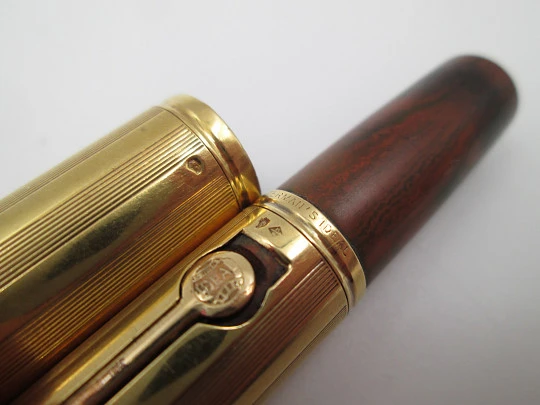 Waterman's Ideal 54. Veined red hard rubber and 18 karat yellow gold. 1920's. United States