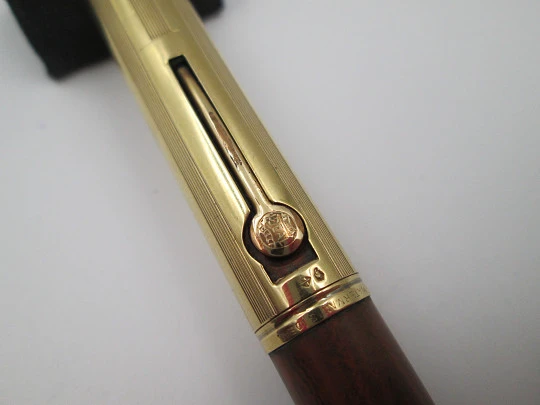 Waterman's Ideal 54. Veined red hard rubber and 18 karat yellow gold. 1920's. United States