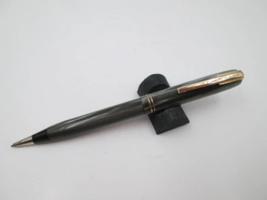 Waterman's mechanical pencil. Marble celluloid & gold plated. Twist system. Canada