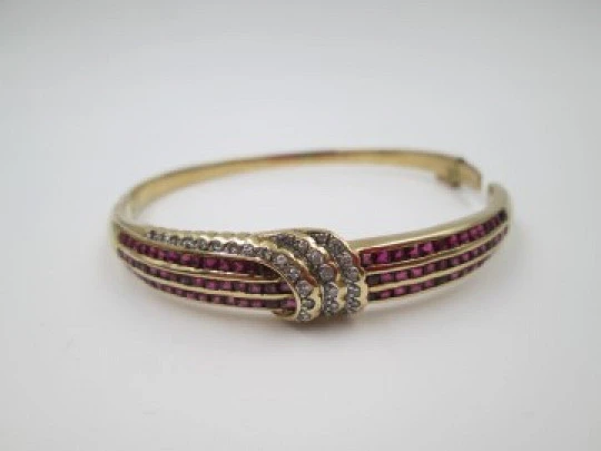 Wedding hinged oval bangle. 18k yellow gold, rubies and diamonds. 1960's