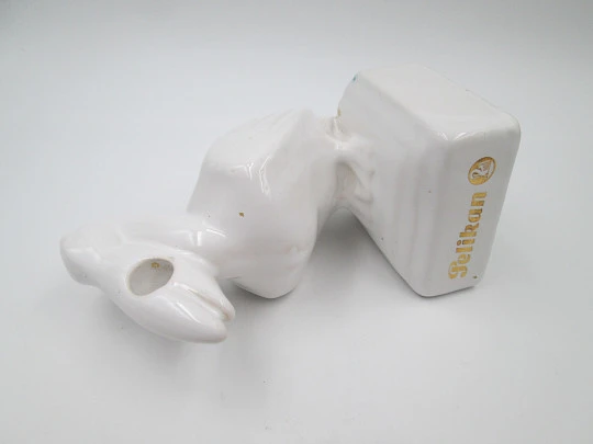 White ceramic Pelikan pen stand. Pelican shape. Gold lettering. 1990's. Germany