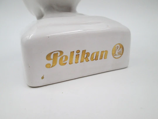 White ceramic Pelikan pen stand. Pelican shape. Gold lettering. 1990's. Germany
