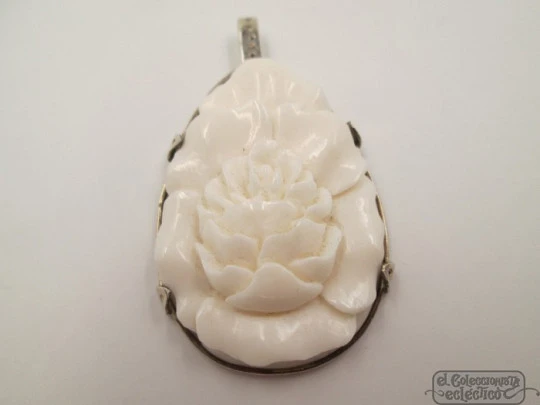 Woman's pendant. Bone and sterling silver. 1950's. Flower motif. Relief