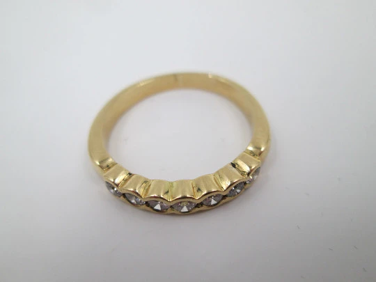 Women's alliance ring. 18 karat gold and seven diamonds. Circa 2005