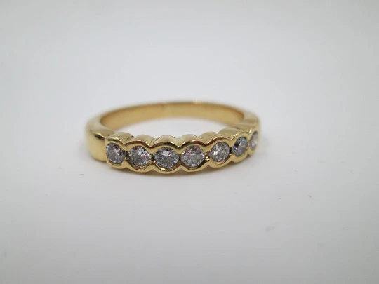 Women's alliance ring. 18 karat gold and seven diamonds. Circa 2005