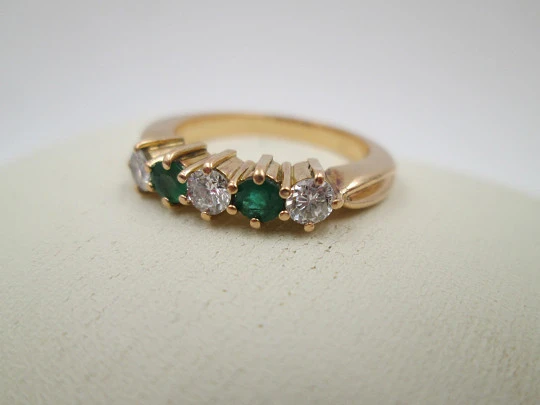 Women's alliance. 18 karat yellow gold, emeralds and diamonds. 2010. Europe