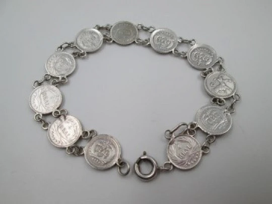 Women's articulated bracelet. 835 sterling silver. Guatemala 1/4 real coins. 1890's