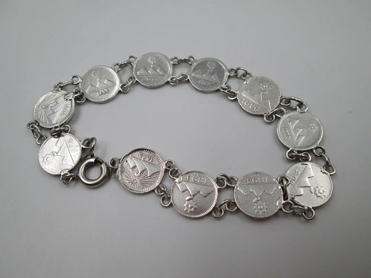 Women's articulated bracelet. 835 sterling silver. Guatemala 1/4 real coins. 1890's