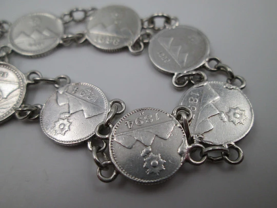 Women's articulated bracelet. 835 sterling silver. Guatemala 1/4 real coins. 1890's