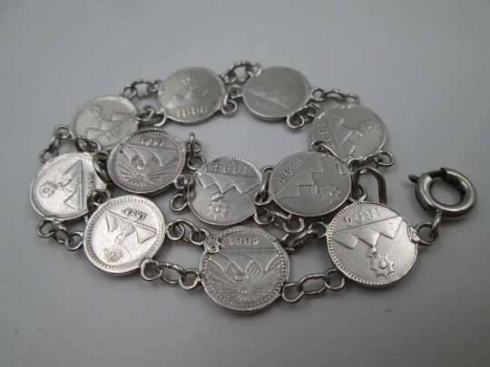 Women's articulated bracelet. 835 sterling silver. Guatemala 1/4 real coins. 1890's