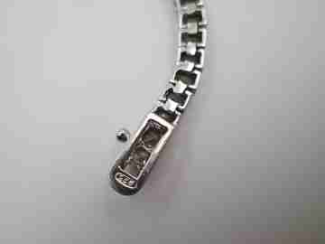 Women's articulated bracelet. 925 sterling silver and zircons. Tab clasp. 1990's