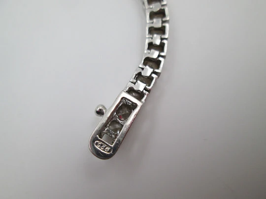 Women's articulated bracelet. 925 sterling silver and zircons. Tab clasp. 1990's