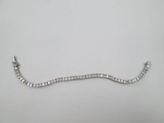 Women's articulated bracelet. 925 sterling silver and zircons. Tab clasp. 1990's