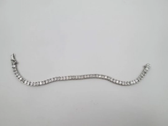 Women's articulated bracelet. 925 sterling silver and zircons. Tab clasp. 1990's