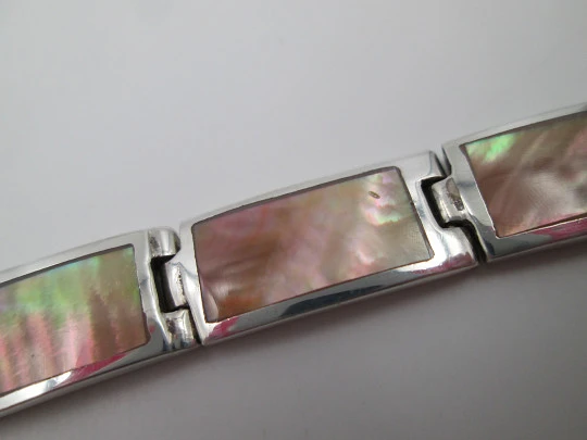 Women's articulated bracelet. 925 sterling silver & mother of pearl details. Tab clasp