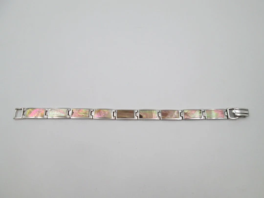 Women's articulated bracelet. 925 sterling silver & mother of pearl details. Tab clasp