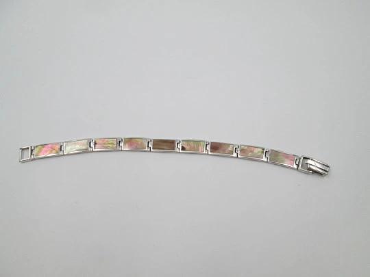 Women's articulated bracelet. 925 sterling silver & mother of pearl details. Tab clasp
