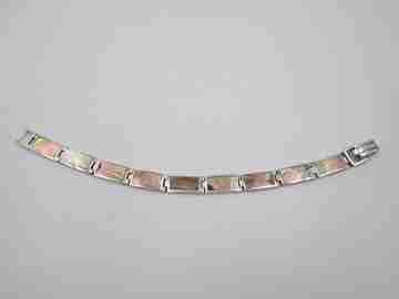 Women's articulated bracelet. 925 sterling silver & mother of pearl details. Tab clasp