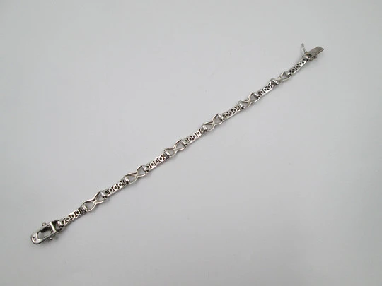Women's articulated bracelet. Alternating links. Sterling silver & white gems. 1990's
