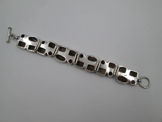 Women's articulated bracelet. Sterling silver 925 thousandths and topazes. 1970's