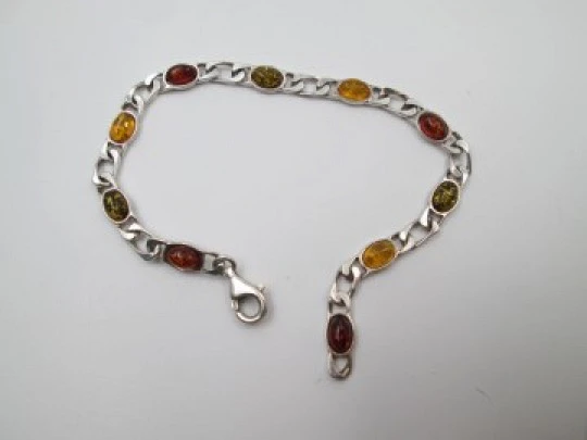 Women's articulated bracelet. Sterling silver & amber color details. 1980's