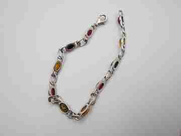Women's articulated bracelet. Sterling silver & amber color details. 1980's