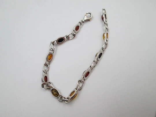 Women's articulated bracelet. Sterling silver & amber color details. 1980's