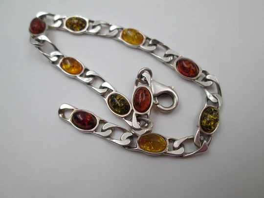 Women's articulated bracelet. Sterling silver & amber color details. 1980's