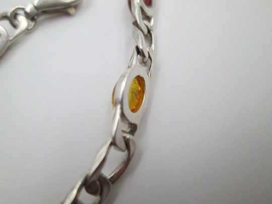 Women's articulated bracelet. Sterling silver & amber color details. 1980's